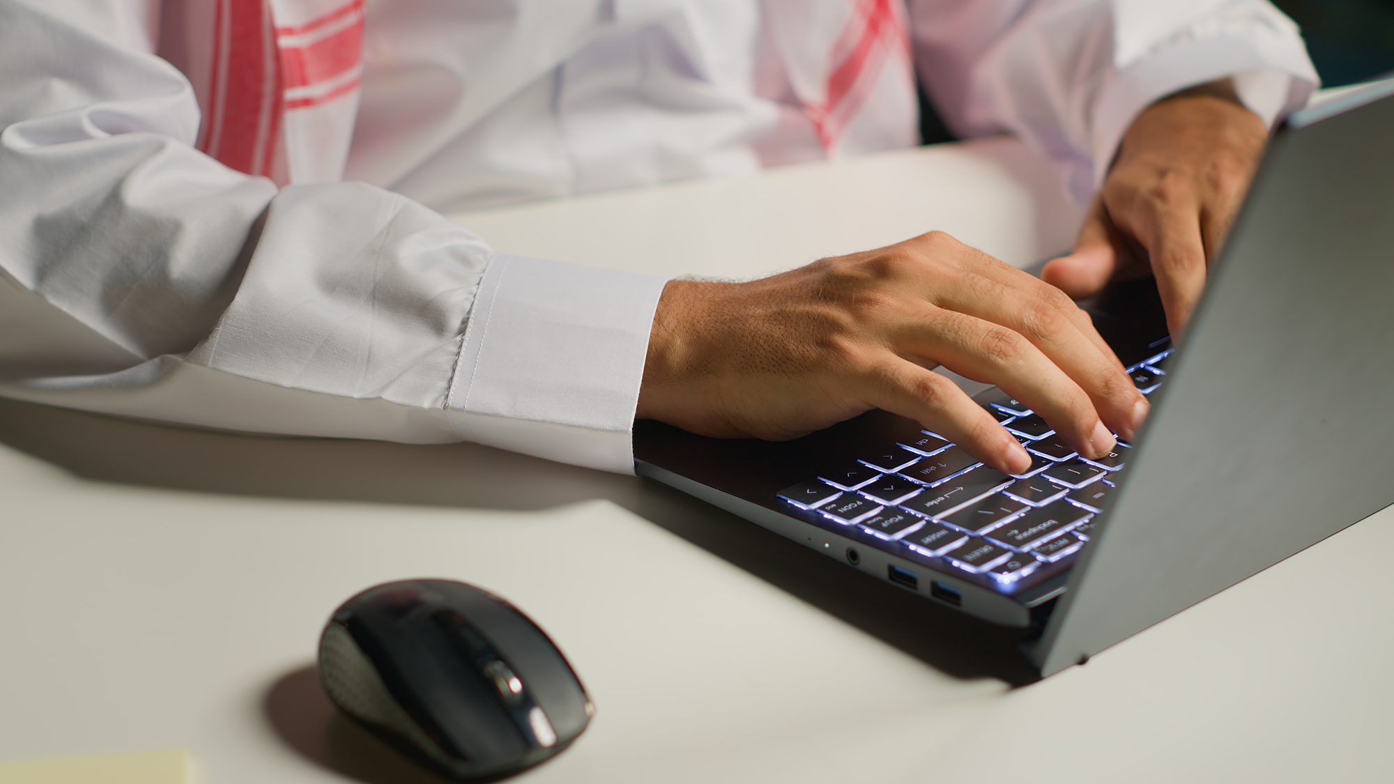 Businessman using laptop and mouse